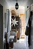 Salvaged timber on fridge with star in hallway of Colchester home Essex UK