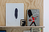 Feather print vintage book and letter F in boy's room Colchester, Essex, UK