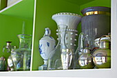 Glass and silverware on green shelves in Massachusetts kitchen, New England, USA