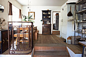 Wrought iron railing in split-level dining room of Hastings home, East Sussex, England, UK