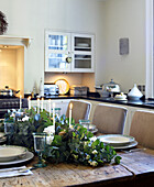 Dining table in a kitchen laid for Christmas lunch