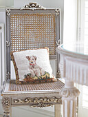 Tapestry cushion on antique chair in Hampshire farmhouse, England, UK