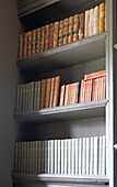Hardbacked reference books in Laughame townhouse, Wales, UK