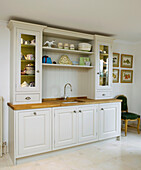 Kitchen dresser with fitted washstand in city of Bath home Somerset, England, UK