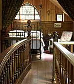 Carved wooden walkway access to bedroom of Shropshire chapel conversion England, UK