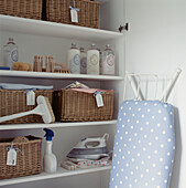 Storage cupboard for laundry and cleaning products