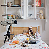 Bedroom full of opened Christmas presents displayed on the bed