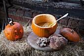 Pumpkin soup of hay bales in rustic barn interior, United Kingdom