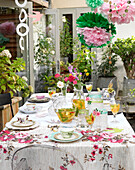 Table set for garden party in Derwent Water, Cumbria, England UK