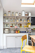 Dried food storage and plates with letters 'K' and 'L' in Reading kitchen Berkshire England UK