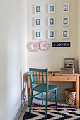 Desk and chair with patterned rug in bedroom of Reading home Berkshire England UK