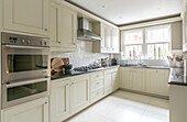 cream fitted kitchen in Guildford townhouse Surrey UK