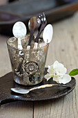 Teaspoons in vintage glass in Sydney home Australia