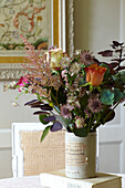 Assorted wildflowers in vintage vase on table in East Cowes home, Isle of Wight, UK