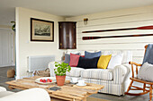 Wall mounted cabinet and oars with sofa and driftwood coffee table Isle of Wight new build UK