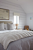 Wood clad bedroom in Isle of Wight new build UK