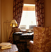 Home office study room with armchair and desk