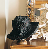 Designer hat on hat stand