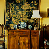 Wooden dresser and tapestry