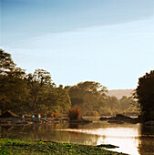 A group of people on a guided walk along the river in the Kruger National park