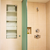 Tiled power shower with towels and screen