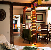 Fairy lights and paper lanterns adorn country cottage living room