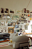 Display of picture postcards on a wall in a home studio office