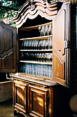 Dresser full of glassware in a cafe restaurant