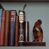 Vintage books on a painted book shelf