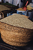 Basket of dried seeds and pulses at a market stall in the medina Fez Morocco
