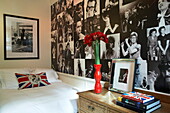 Black and white artwork montage in bedroom of funky London home, England, UK