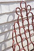 Detail of garden chair made from horse shoes