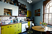 Yellow and Blue vintage styled kitchen with decorative wall tiles