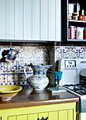 Colourful kitchen detail with Patterned wall tiles