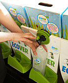 Woman pouring liquid soap from soap dispensers