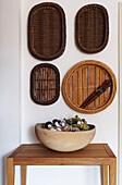 Display of vintage baskets and weaving material