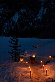 Lit oil burners and brazier in mountain snow, Zermatt, Valais, Switzerland