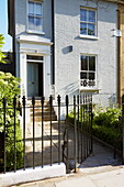 Open gate to front door of London townhouse, England, UK