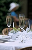 Champagne glasses and Swarovski crystal glass table decorations at wedding reception