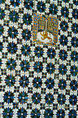 Azulejos tiles with coat of arms on a wall in the internal courtyard of the Casa Pilatos in the Santa Cruz area of Seville