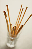 Small glass with wooden cocktail sticks