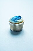 Blue Glittery Cup cake on a white background