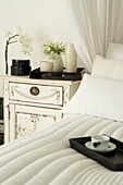 Crisp white bed linen in a white bedroom