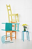 Painted wooden chairs in white interior of contemporary family home