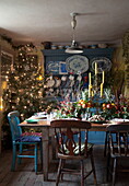 Dining table set for Christmas dinner in Benenden cottage,  Kent,  England,  UK