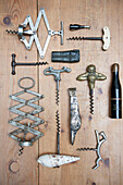 Assorted corkscrews on wooden tabletop in South Kensington  London  UK