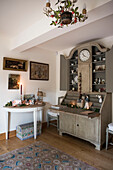 Antique writing desk and demi-lune table in East Sussex coach house  England  UK