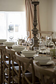 Wineglasses and bowls on dining table in Petworth farmhouse West Sussex Kent
