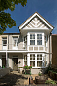 Exterior of pebbledashed Edwardian semidetached house in Worthing UK