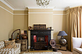 Neutral Living room with sofa and bay window in Edwardian West Sussex townhouse England UK